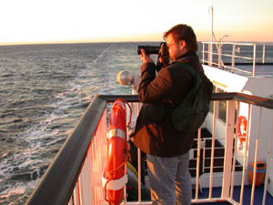 Jakub taking photo of the sunset. The last ferry to Germany.