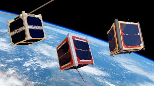 Družice CubeSat obíhající kolem Země. Umělecká vize ESA.